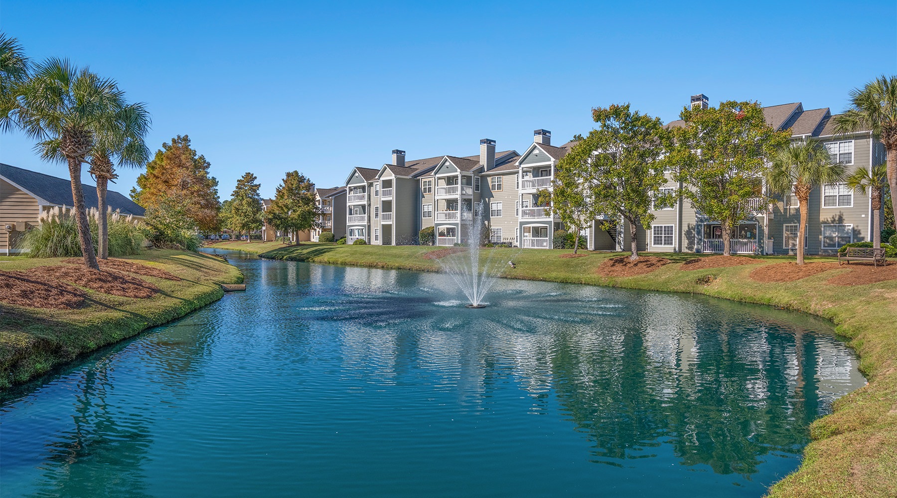 parallax image Exterior of Palmetto Point apartments in Myrtle Beach