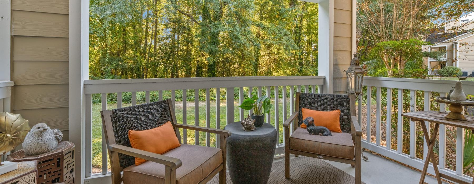 a patio with chairs and a table